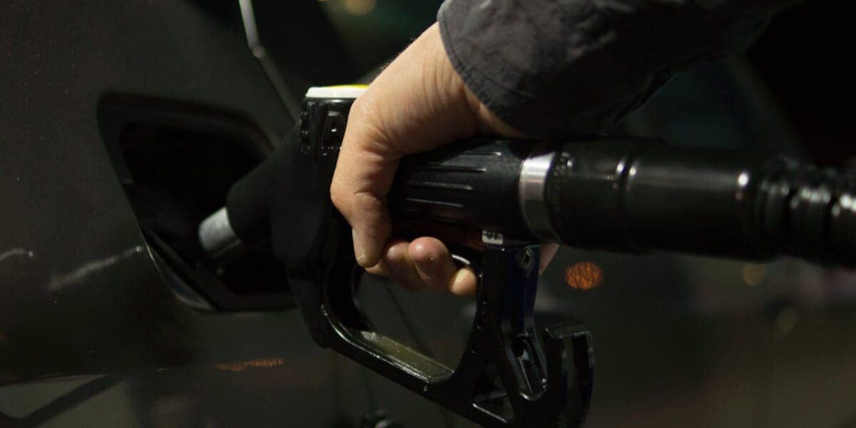 Petrol pump nozzle at a Dutch station with price sign visible
