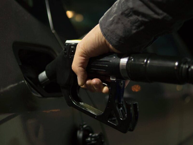 Petrol pump nozzle at a Dutch station with price sign visible