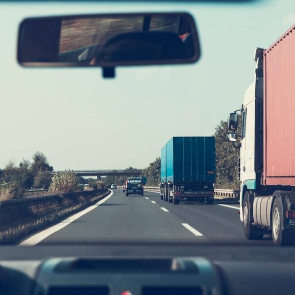 New lorry driver learning the job with mentor at work