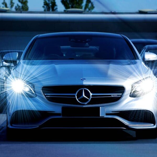 A luxury Mercedes-Benz car in a modern setting, highlighting financial lease options