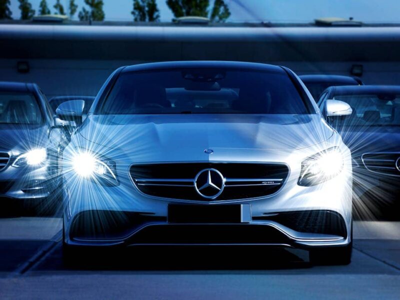 A luxury Mercedes-Benz car in a modern setting, highlighting financial lease options