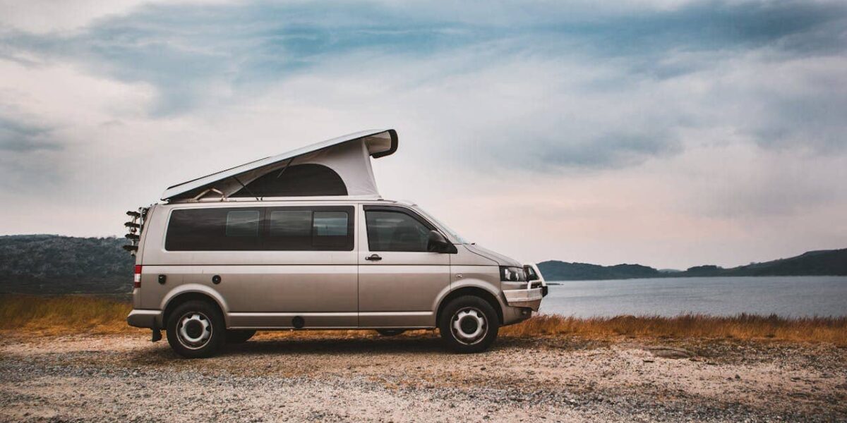 Campervan for retirees parked in scenic nature, symbolising freedom, adventure and retirement