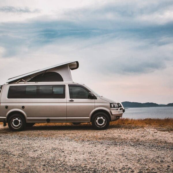 Campervan for retirees parked in scenic nature, symbolising freedom, adventure and retirement