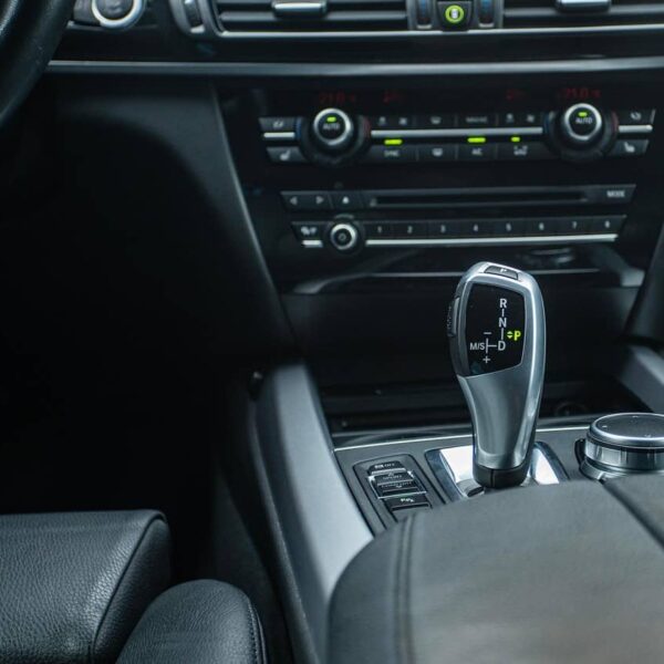 Black car gearstick in close-up