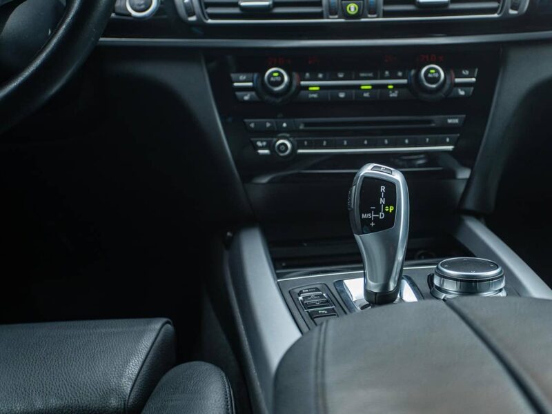 Black car gearstick in close-up