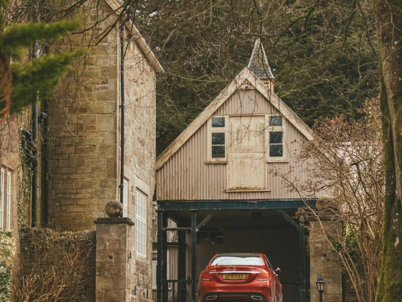 Modern garage with premium floor coating, stylish car, seamless surface, clean and neat atmosphere