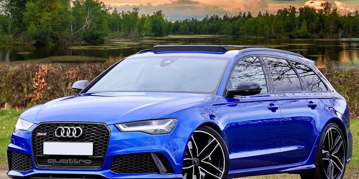 Audi RS6 estate car side view in city street, daytime