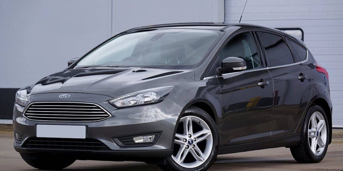 Ford Transit Custom company van on lease parked in front of a modern business building